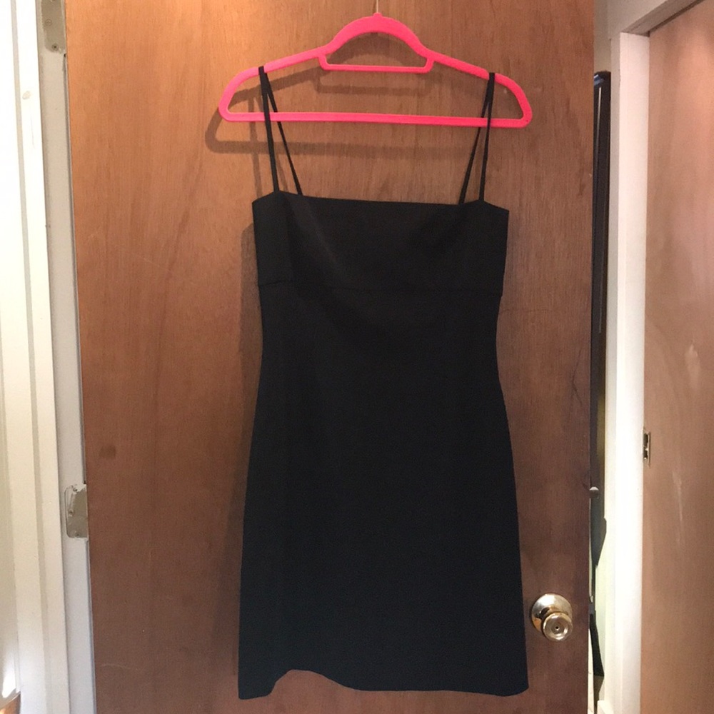 Very cute little black dress!!! Size 8.